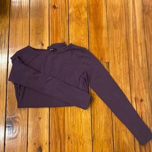 Dark purple, long sleeve body suit.